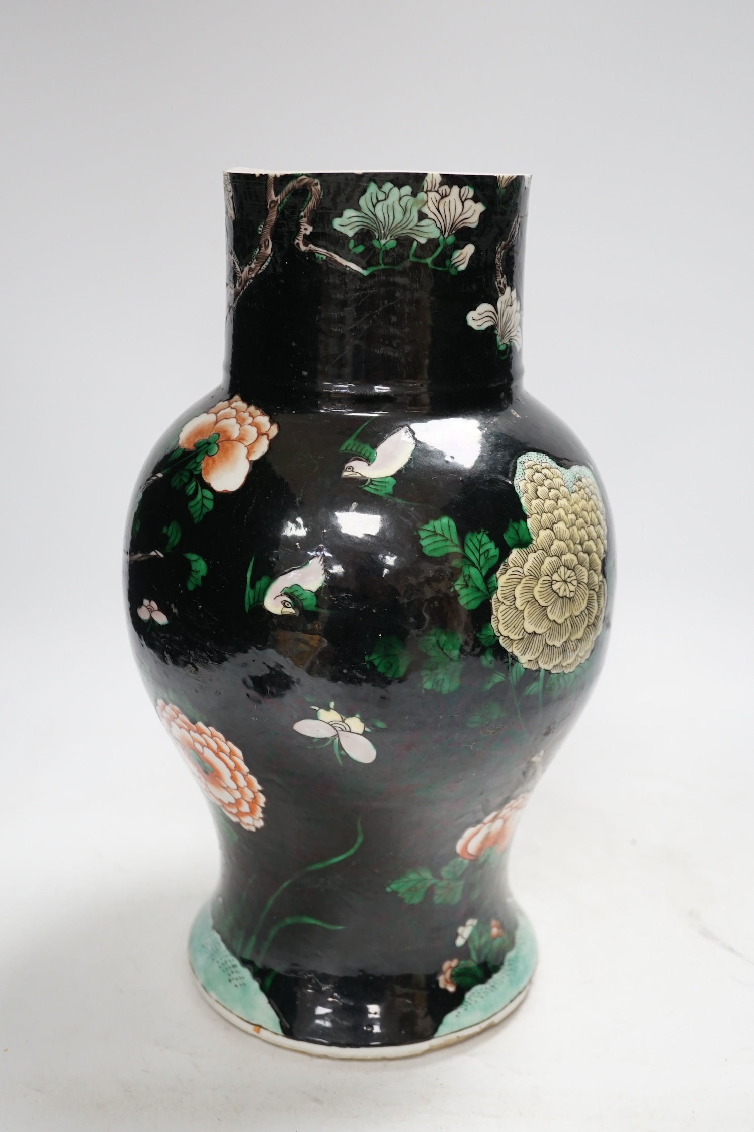 Three Chinese vases, 19th/early 20th century, including a cut down famille noire vase, crackleglaze and blue and white vases, tallest 34cm. Condition - fair to poor